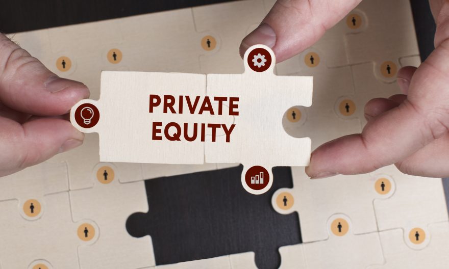 Young businessman shows the word: Private equity